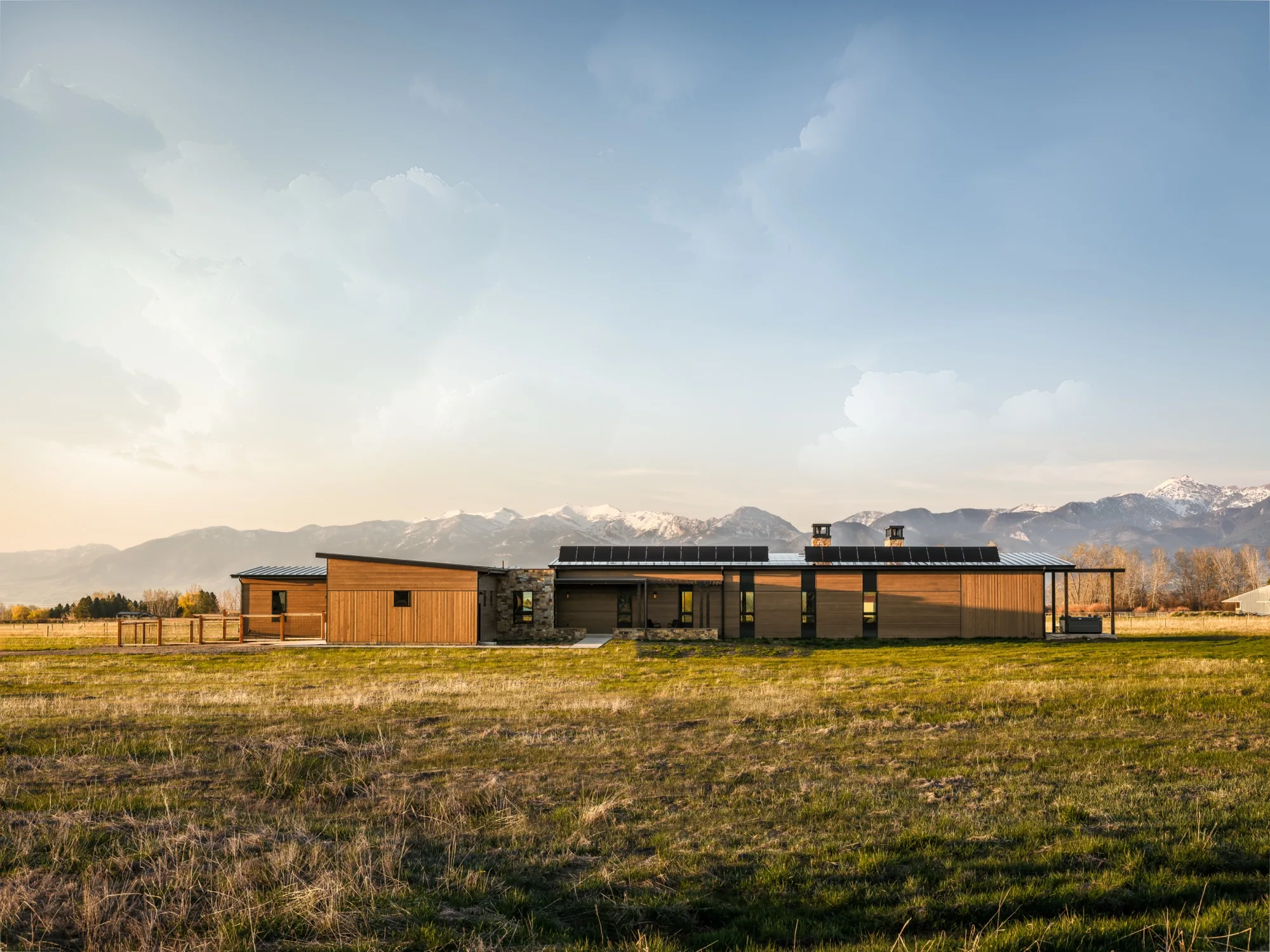 An Ebbighausen home at golden hour with the mountains behind it