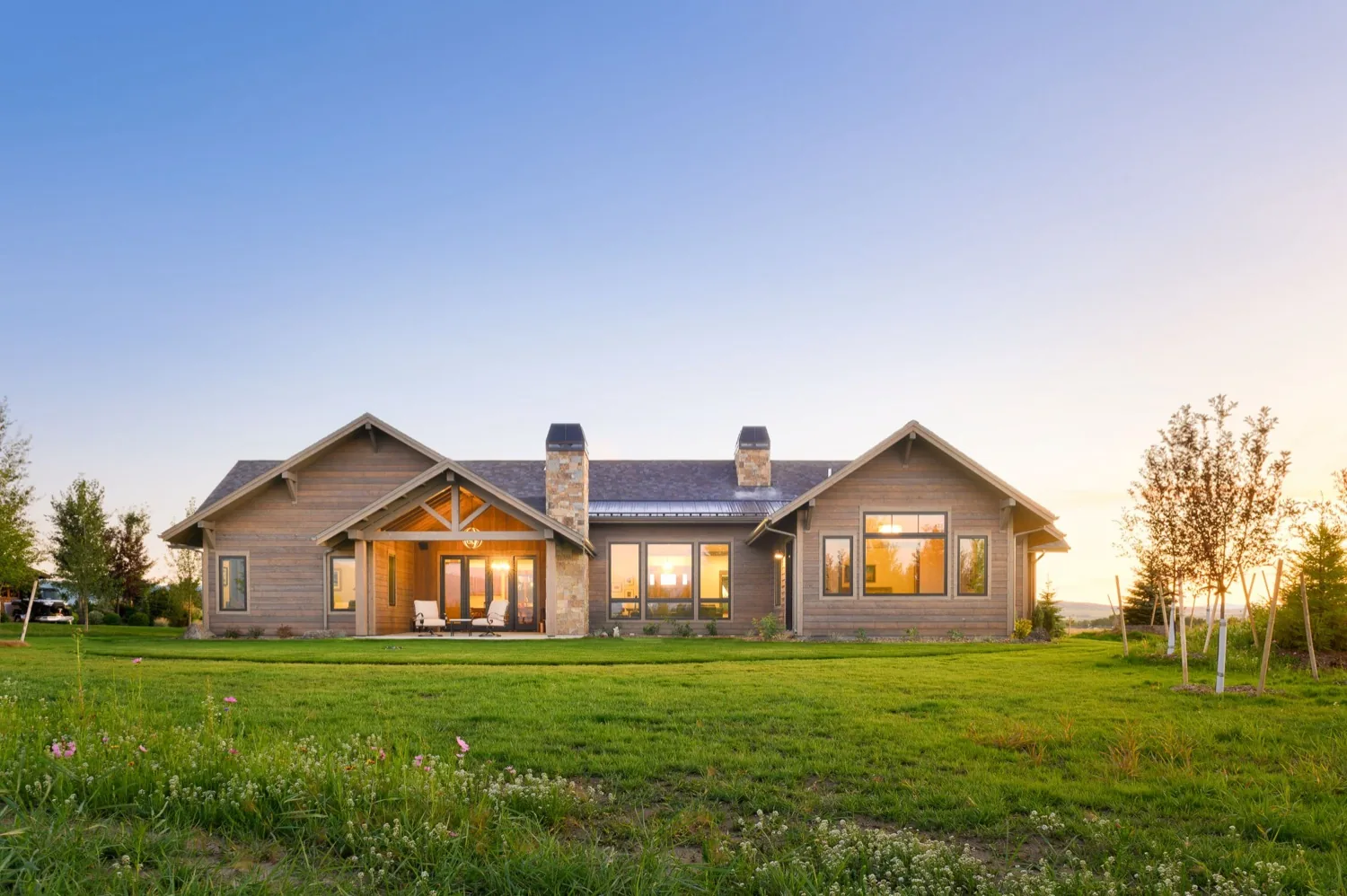 Rustic Montana home, rear elevation at sunset